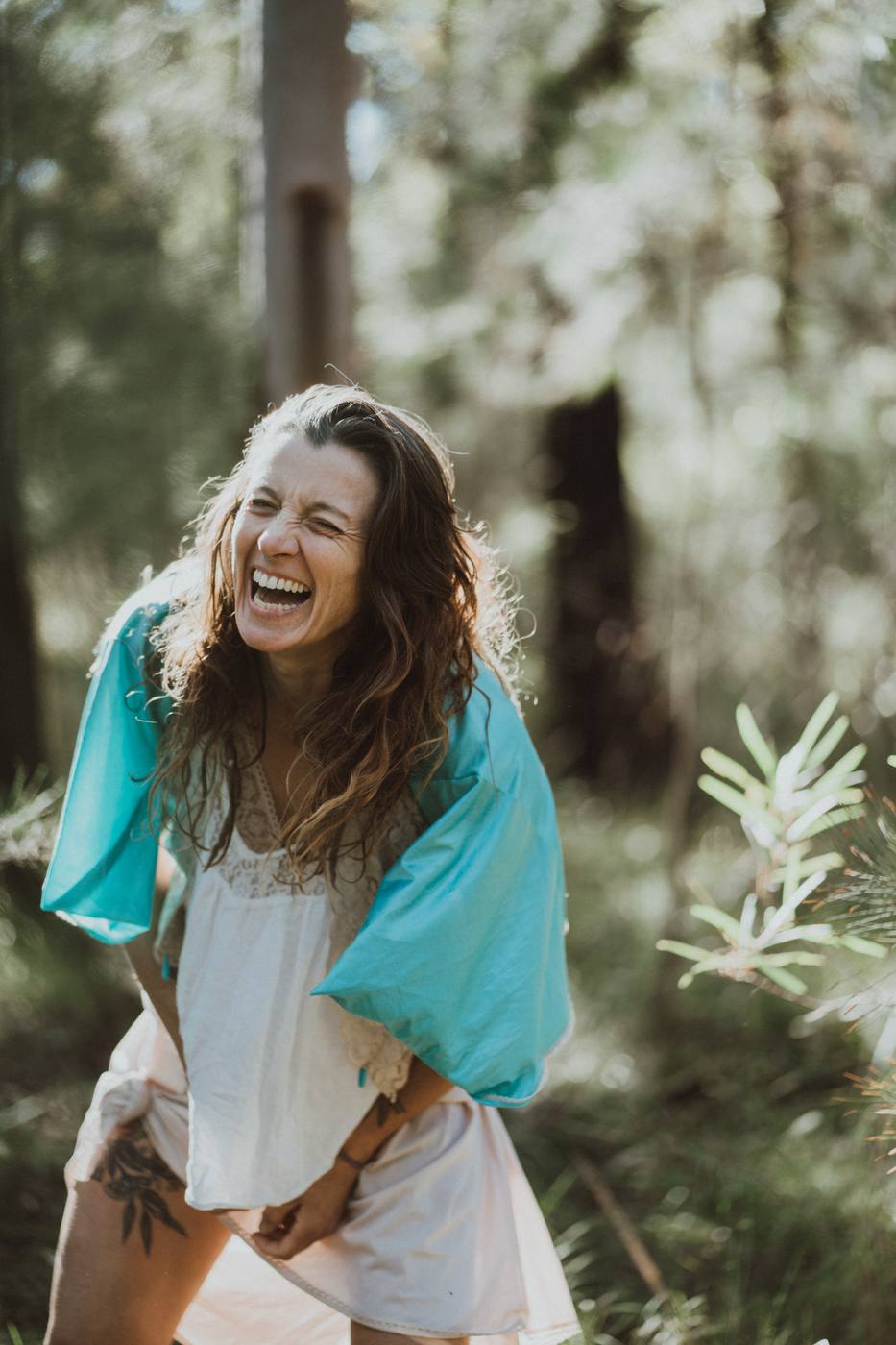 Ro laughing joyfully in the forest